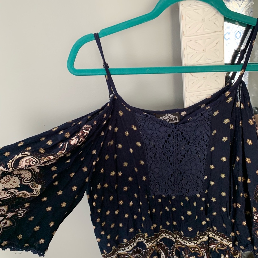 Navy blue patterned shirt with tassels